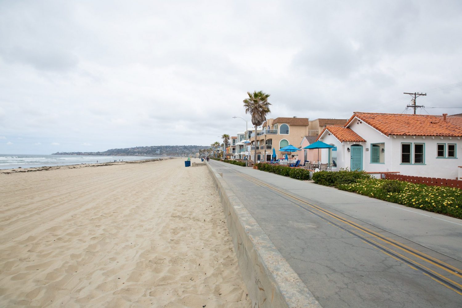 view of the street and the beach in front of the house